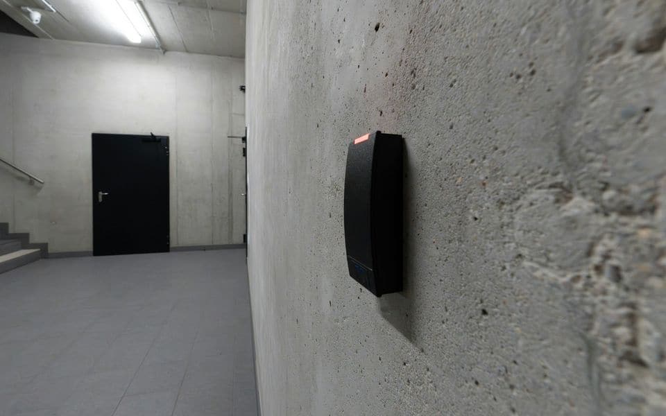 A contactless smart card reader mounted beside an access-controlled door